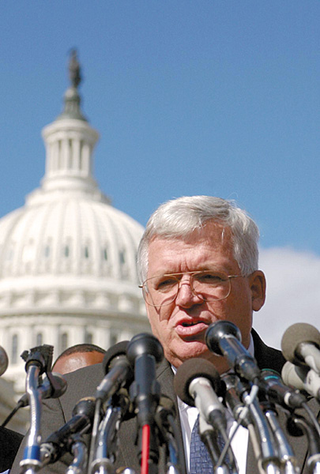 Hastert addresses reporters.